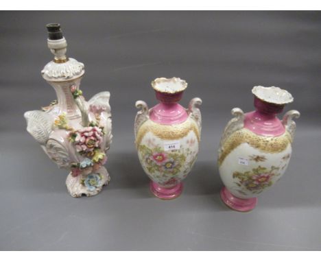 Pair of late 19th / early 20th Century English pottery two handled baluster form vases, decorated with flowers, 13.5ins high,