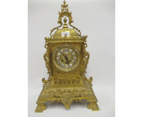 Late 19th / early 20th Century French gilt brass mantel clock, the gilt dial with enamel Roman cartouche numerals, signed ' G