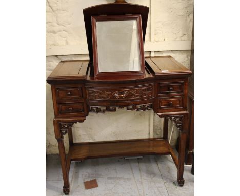 Late 20th Century Chinese exotic hardwood dressing table, the integral folding mirror above an arrangement of five drawers, t