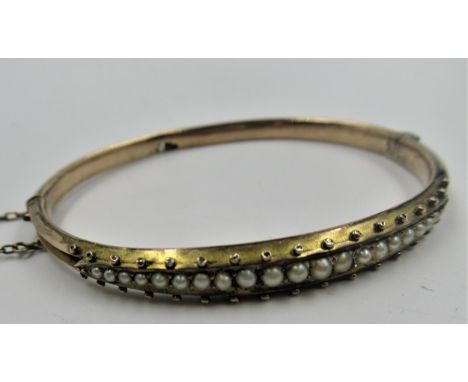 Victorian gold seed pearl set bangle, 7g 