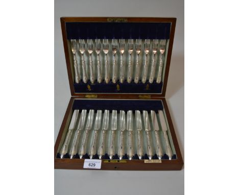 Cased set of twelve silver plated fruit knives and forks by Walker & Hall 