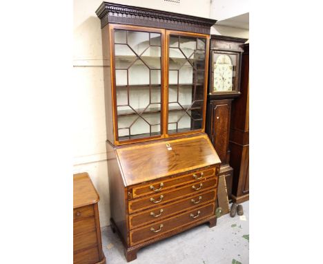 George III mahogany and satinwood crossbanded bureau bookcase, the moulded dentil cornice above a pair of astragal glazed doo
