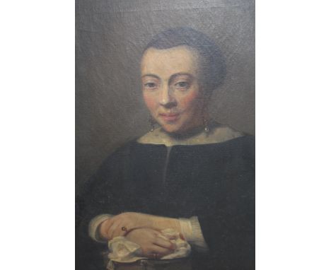 An antique oil on canvas, portrait of a 17th Century Dutch lady, gilt framed26.5ins x 23ins Small patch repairs to back (in h