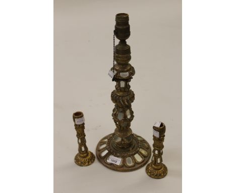 Continental gilt and mirror decorated table lamp together with a pair of similar candlesticks 