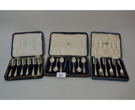 Boxed set of six silver cake forks, together with a part set of cake forks and a cased set of six silver coffee spoons with t