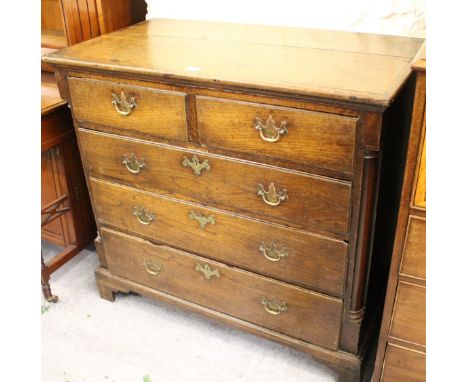 George III oak straight front chest of two short and three long drawers with brass handles, flanked by quarter pilasters, rai