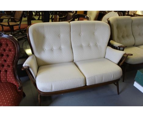 20th Century Ercol stickback sitting room suite comprising:  two 2-seat sofas and a rocking chair 