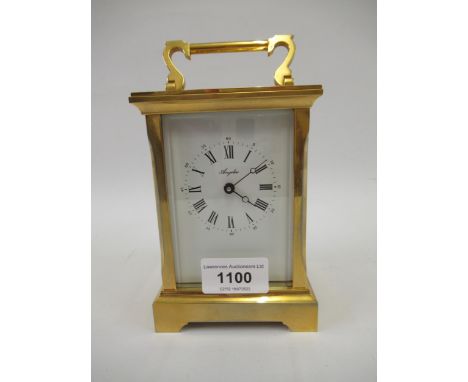 Good quality modern gilt brass cased carriage clock, the enamel dial with Arabic and Roman numerals signed Angelus, with a si
