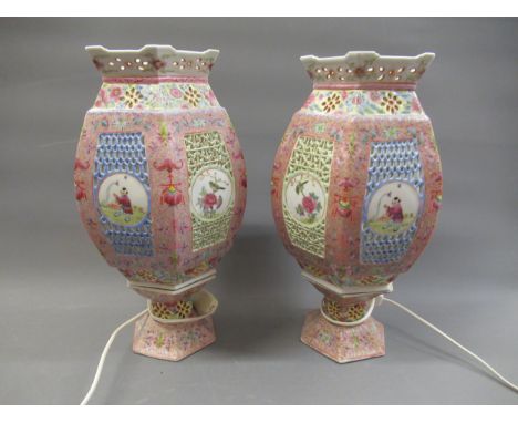 Pair of 20th Century Chinese famille rose hexagonal lantern form table lamps (adapted for use with electricity), each in two 