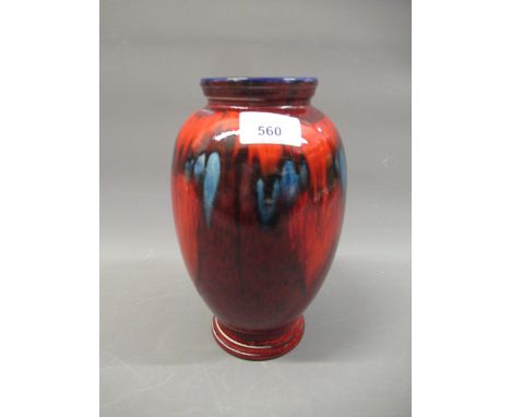 Poole Pottery baluster form vase with abstract decoration on red lustre ground, 9ins high 