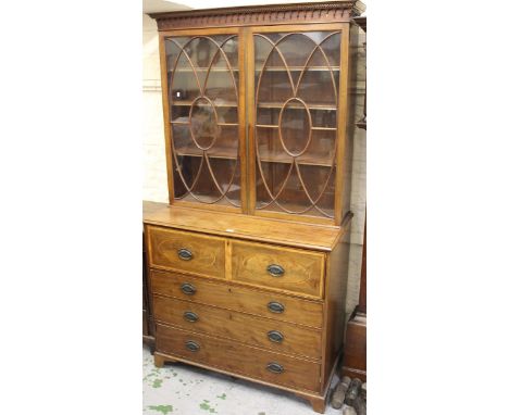 George III mahogany satinwood crossbanded secretaire bookcase, the moulded cornice above two astragal glazed doors, a fitted 