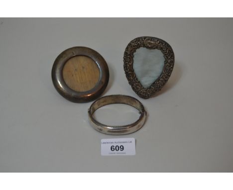 Two small silver photograph frames, a silver bangle and a quantity of various plated items including a claret jugCircular fra