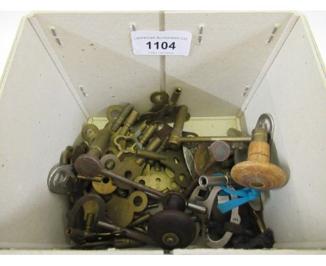 Box containing a small quantity of various clock keys, including three longcase clock keys 