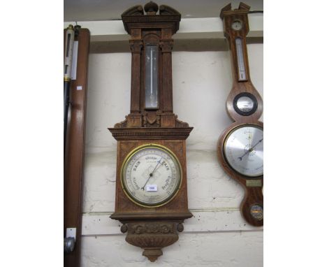Late 19th / early 20th Century carved oak aneroid barometer thermometer by Negretti & Zambra, in architectural form case (the