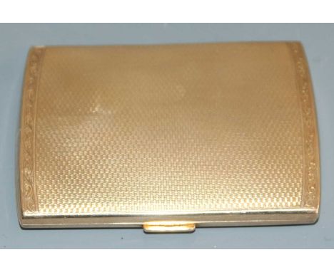 An Art Deco 9ct gold pocket cigarette case, having all-over engine exterior with engraved floral stylised border, the interio