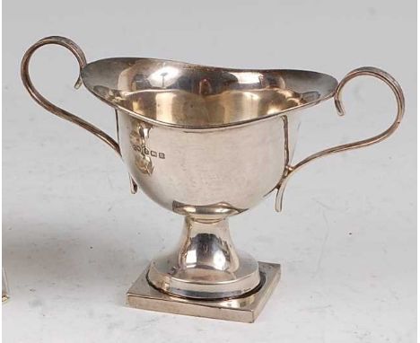 A small early 20th century silver twin handled pedestal trophy cup, undecorated, maker Charles Weale, Birmingham 1911, 3.7oz,