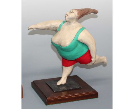 Christian Paix - Woman exercising, painted ceramic, moulded Paix to integral base, within further mahogany surround, overall 
