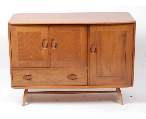 A 1960s Ercol light elm Windsor sideboard, model 366, with arrangement of three cupboard doors and single lower drawer, h.78.