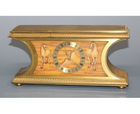 A mid-20th century gilt brass mantel clock by Luxor, the enamel effect dial depicting horses after Leonardi di Vinci, titled 
