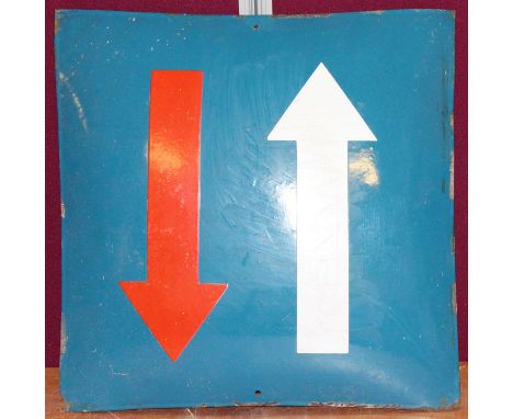 A mid-20th century French enamel on metal two-way street sign, painted in blue, red and white, of convex form, 49 x 49cm