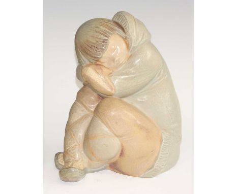 A large Lladro pottery figure of a seated Eskimo girl, her arms and legs crossed, printed backstamp verso, h.25cmCondition re
