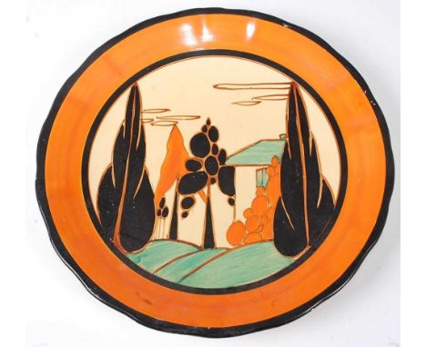 A Clarice Cliff Orange Trees and House pattern pottery wall plate, of circular form and with slightly wavy outer edge, bright