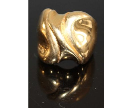 A 1970s 18ct gold dress ring by Minas Spiridis, of abstract stylised form, indistinctly signed to top edge, stamped 750 to th