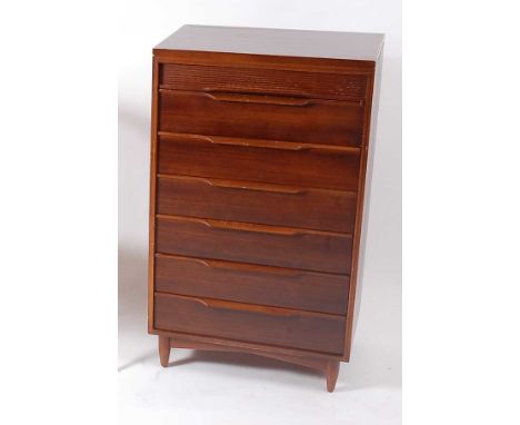 White &amp; Newton - a 1960s teak narrow chest, of seven long drawers, raised on squat turned supports, label to inside upper