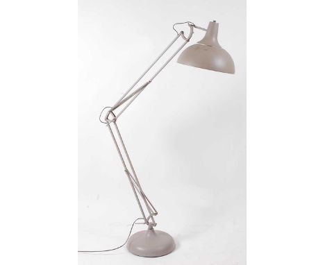 A contemporary grey painted floor standing anglepoise style lamp, of typical hinged rotating form, with integral domed shade,