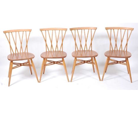 A set of four 1960s Ercol light elm candlestick kitchen chairs, model 3462, w.41cmCondition report: Each stand well, structur