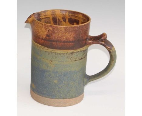 Robin Welch Pottery - a large stoneware single handled water jug, painted in tones of brown and blue, impressed pottery stamp