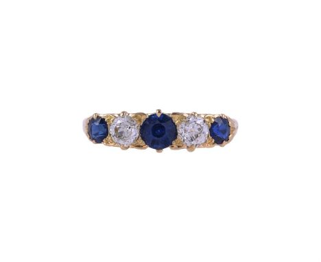 AN EARLY 20TH CENTURY SAPPHIRE AND DIAMOND FIVE STONE RINGThe graduated circular cut sapphires with old European cut diamonds