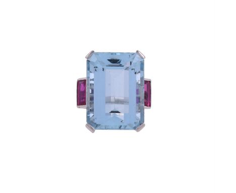 A MID 20TH CENTURY AQUAMARINE AND RUBY COCKTAIL RING The step cut aquamarine with canted corners in a four claw setting, esti