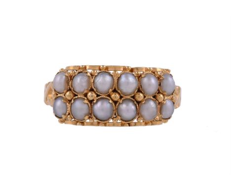 A VICTORIAN TWO ROW HALF PEARL RING BIRMINGHAM 1867The two rows of half pearls with beaded gold accents, to pierced crossover