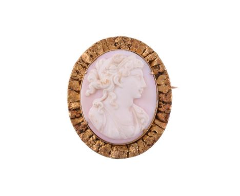 JULES EGGERT, ATLIN, BRITISH COLOMBIA, CANADA, A PROSPECTORS CONCH SHELL CAMEO BROOCH AND BRACELETCIRCA 1910The oval shell ca