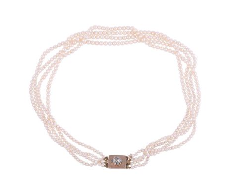 A GRADUATED FOUR STRAND PEARL NECKLACE TO A DIAMOND CLASPThe graduated pearls to a rectangular gold clasp, with an applied ol