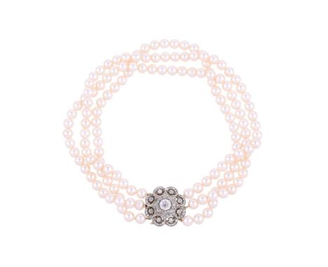 A THREE STRAND CULTURED PEARL NECKLACE WITH A DIAMOND CLUSTER CLASPThe three rows of uniform cultured pearls to a pierced flo