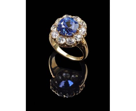 A COLOUR CHANGE SAPPHIRE AND DIAMOND CLUSTER RING, SRI LANKA (CEYLON), NO HEATThe cushion cut sapphire with blue to purple co