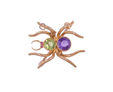 AN EDWARDIAN PERIDOT, AMETHYST AND RUBY SPIDER BROOCH CIRCA 1910The spider with circular cut ruby eyes, a circular cut perido