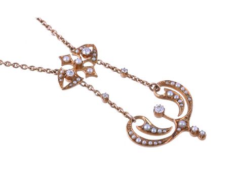 AN ART NOUVEAU GOLD PENDANT CIRCA 1910 The pierced whiplash panel set with graduated half pearls with an old cut diamond acce
