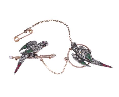 AN EARLY 20TH CENTURY PASTE DOUBLE PARROT BROOCH CIRCA 1900The silver parrots set with red, white and green circular white pa