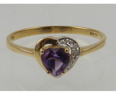 A 9 carat yellow gold and amethyst heart-shaped ring. 