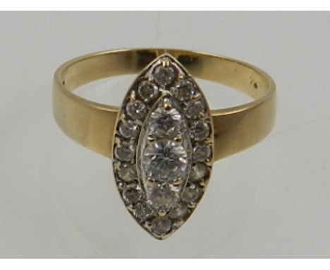 A 9 carat yellow gold and white stone ring of lozenge form. 