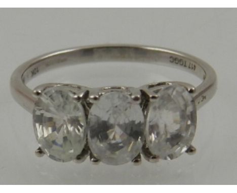 A 9 carat white gold and Ratanakiri zircon three stone ring, set three oval cut zircons.