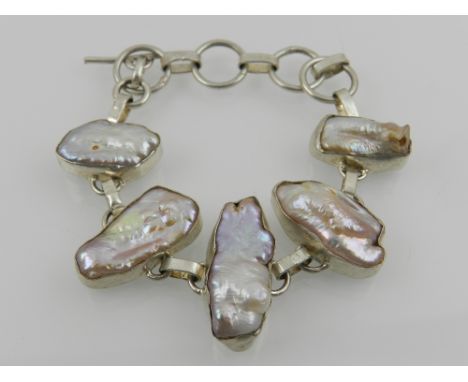 A silver and blister pearl articulated bracelet. 