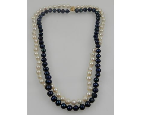 In the style of Chanel. A two strand black and white South Sea pearl 8-9mm AAA pearl necklace.