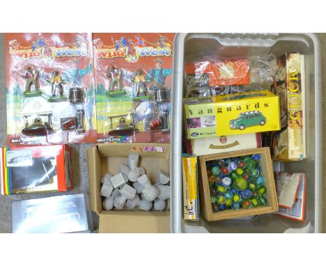 Model vehicles, toys and games including two Britains Wild West bubble packs, log sled boxed and Britains Petite milk churns,