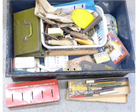 A tin trunk with other tins, old keys, hobby tools, etc.