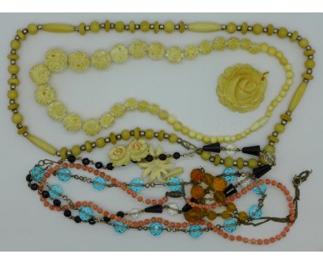 A vintage glass bead necklace and carved bone and ivory jewellery