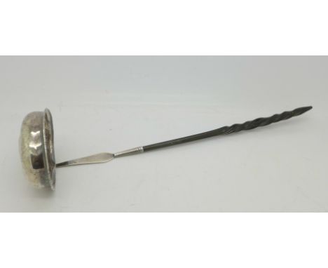 A white metal ladle with whale bone handle, set with a 1758 George II coin